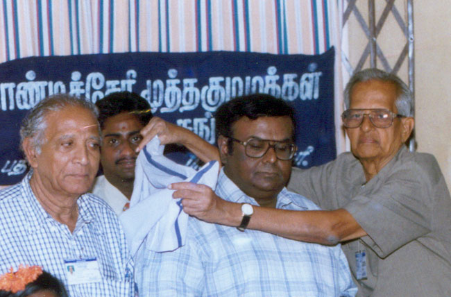 Mr.S.V.Purshothaman honouring D.A.Joseph